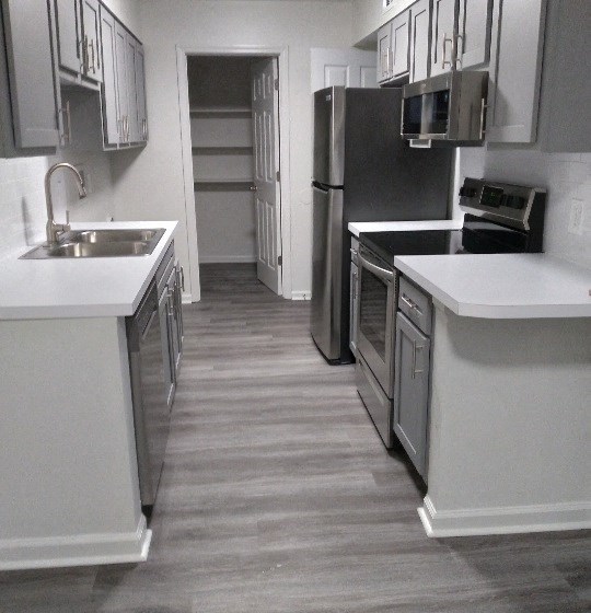 Renovated Kitchen with Washer and Dryer Hookups at RIVERHOUSE, Riverside